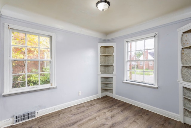 spare room with light wood-type flooring