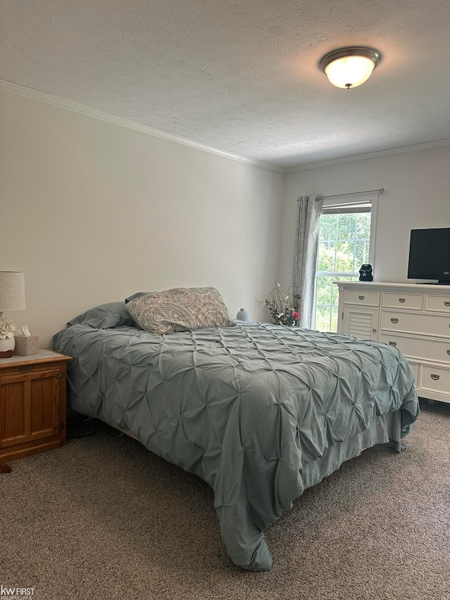 bedroom with carpet flooring, crown molding, and a textured ceiling