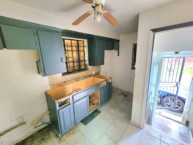 kitchen featuring ceiling fan