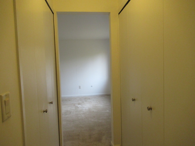 corridor with carpet floors