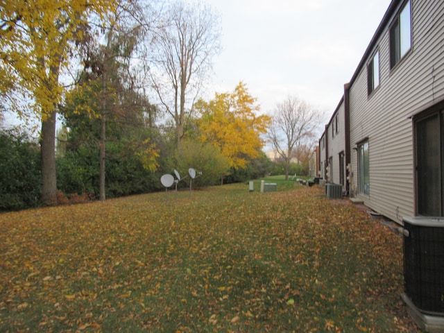 view of yard with central air condition unit