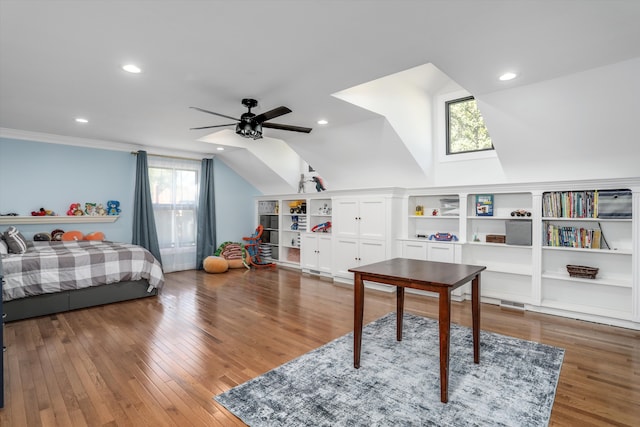 bedroom with multiple windows, ceiling fan, dark hardwood / wood-style flooring, and lofted ceiling