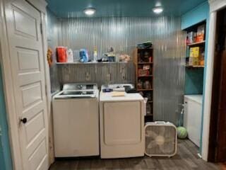 washroom featuring washer and clothes dryer and dark hardwood / wood-style floors