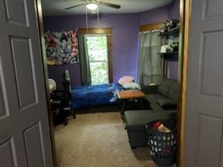 bedroom with ceiling fan and carpet floors