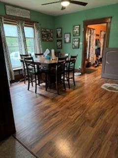 dining area with hardwood / wood-style floors and ceiling fan