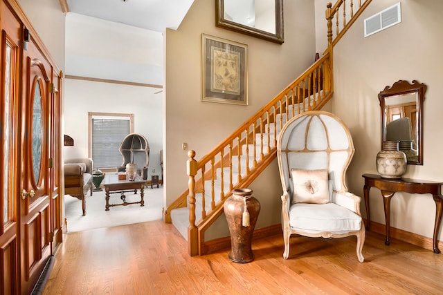 entryway with light hardwood / wood-style floors