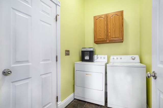 laundry area with washer and dryer and cabinets