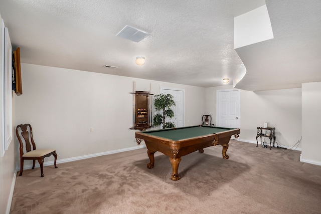 recreation room with carpet floors, a textured ceiling, and pool table