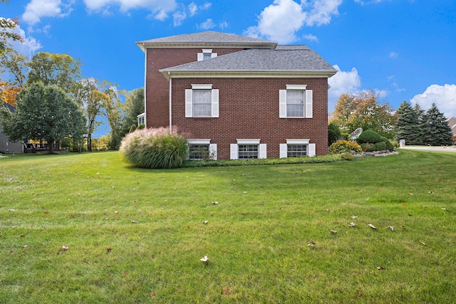 view of home's exterior featuring a yard