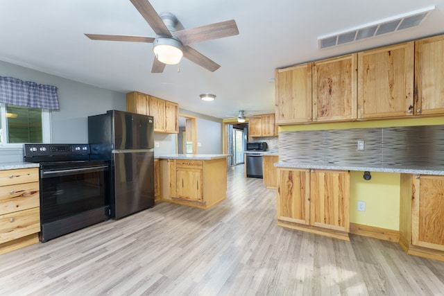 kitchen featuring black appliances, ceiling fan, light wood-type flooring, tasteful backsplash, and kitchen peninsula