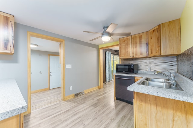 kitchen with ceiling fan, dishwasher, sink, backsplash, and light wood-type flooring