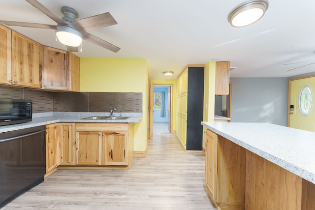 kitchen with dishwasher, sink, ceiling fan, decorative backsplash, and light wood-type flooring