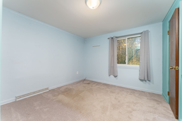 carpeted spare room with crown molding