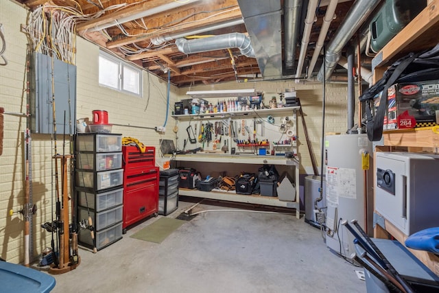 basement with a workshop area and water heater