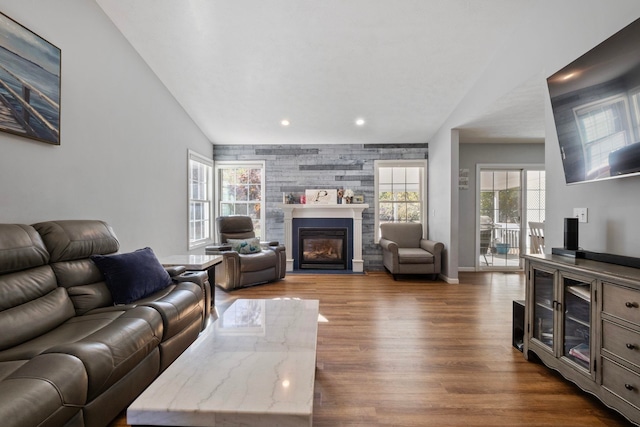 living room with dark wood-type flooring and lofted ceiling