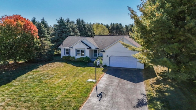 single story home featuring a garage and a front lawn