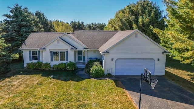 single story home featuring a garage and a front lawn