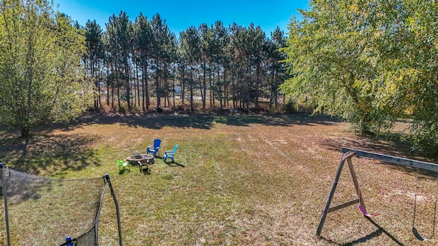 view of yard with an outdoor fire pit