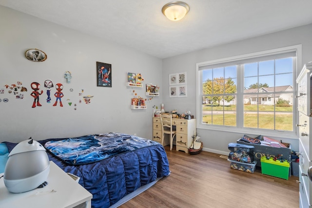 bedroom with wood-type flooring