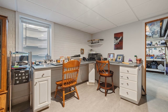 home office featuring a paneled ceiling