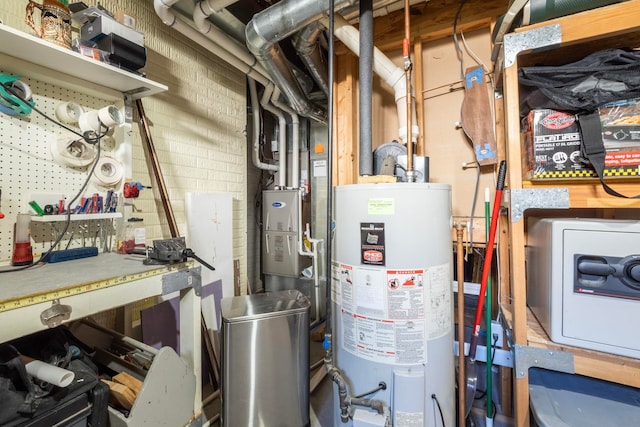 utility room with gas water heater