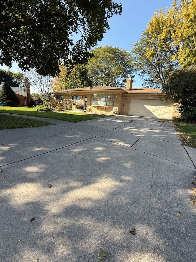 view of front facade with a front lawn and a garage