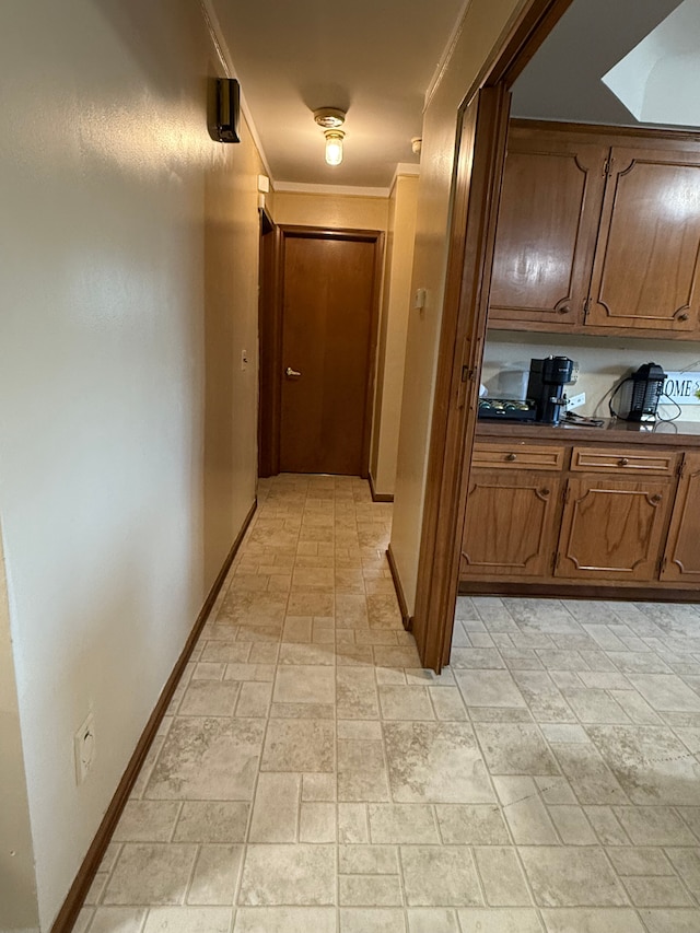 corridor featuring ornamental molding