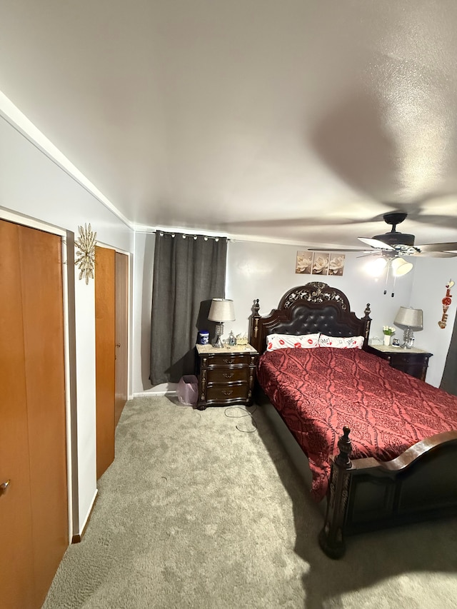 carpeted bedroom featuring ceiling fan