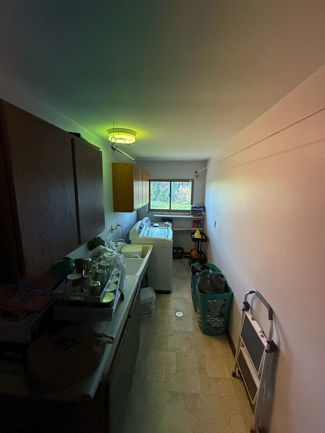 interior space featuring independent washer and dryer and sink