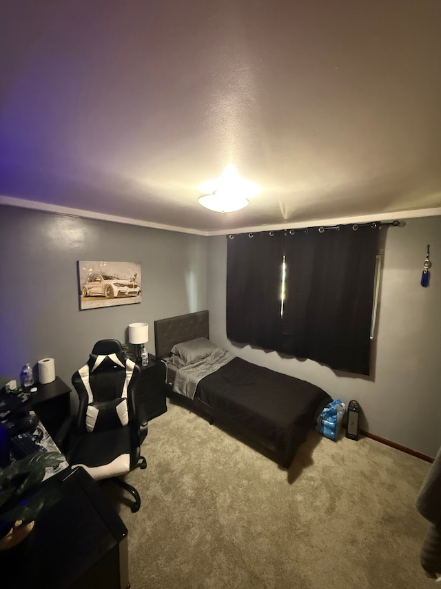 bedroom with carpet floors and ornamental molding