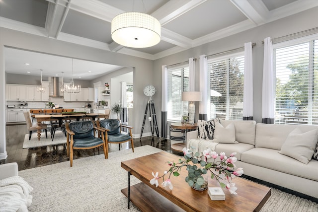 living room featuring hardwood / wood-style floors, a healthy amount of sunlight, and coffered ceiling