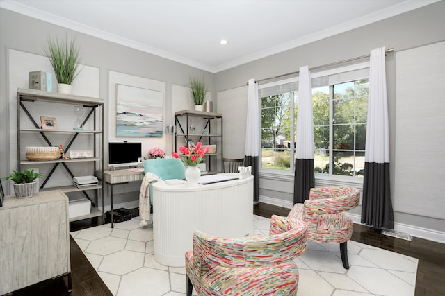 home office with crown molding and light hardwood / wood-style flooring