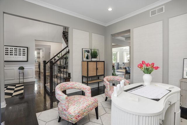 living room featuring crown molding and light hardwood / wood-style flooring