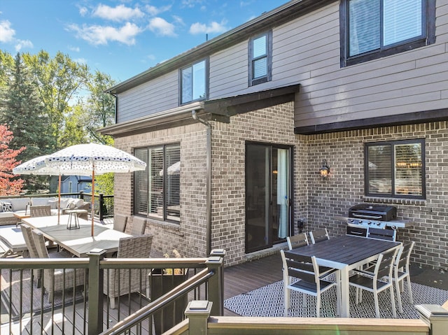 wooden terrace with area for grilling