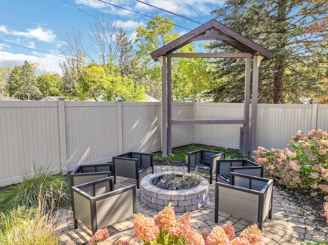 view of patio / terrace featuring a fire pit