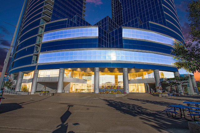 view of outdoor building at dusk