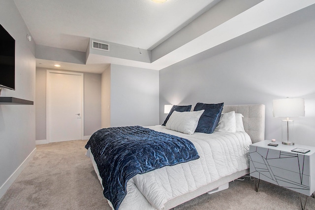 bedroom featuring light carpet