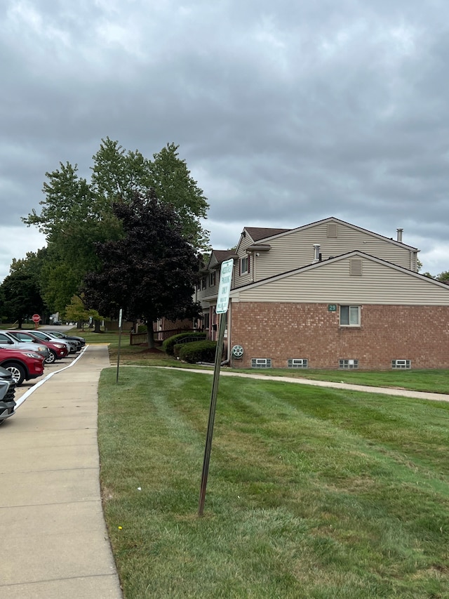 view of property exterior featuring a yard