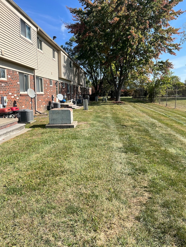 view of yard featuring central AC