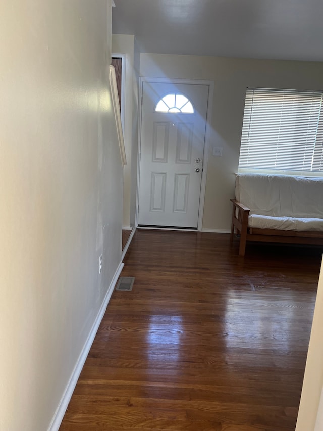 doorway to outside with dark hardwood / wood-style floors