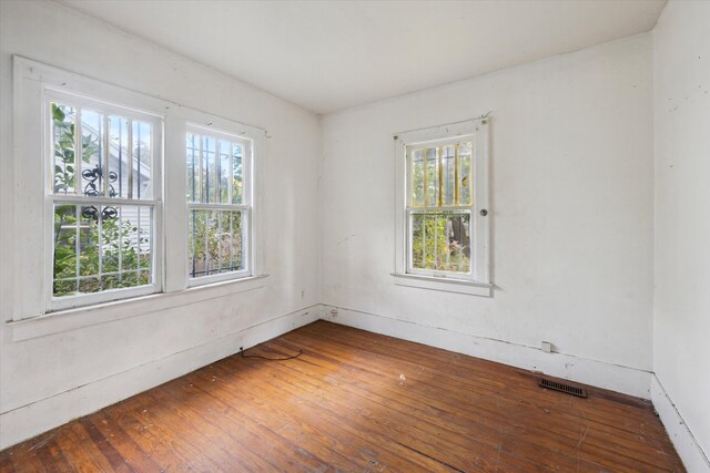 2515 Bagley St, Flint, MI 48504 - spare room featuring hardwood / wood-style flooring