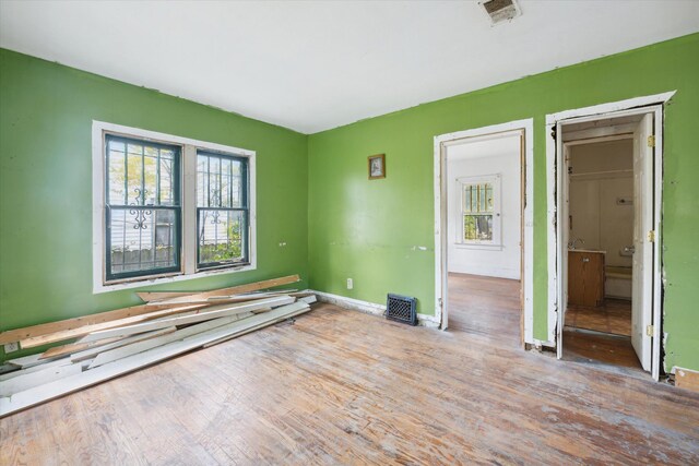 2515 Bagley St, Flint, MI 48504 - unfurnished bedroom with wood finished floors and baseboards