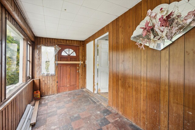2515 Bagley St, Flint, MI 48504 - entryway with wood walls and stone finish flooring