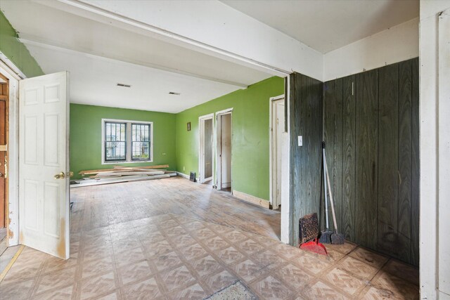 2515 Bagley St, Flint, MI 48504 - spare room with tile patterned floors and baseboards