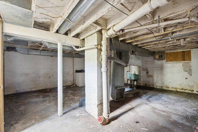 2515 Bagley St, Flint, MI 48504 - unfinished basement featuring washer / dryer, electric panel, and a sink