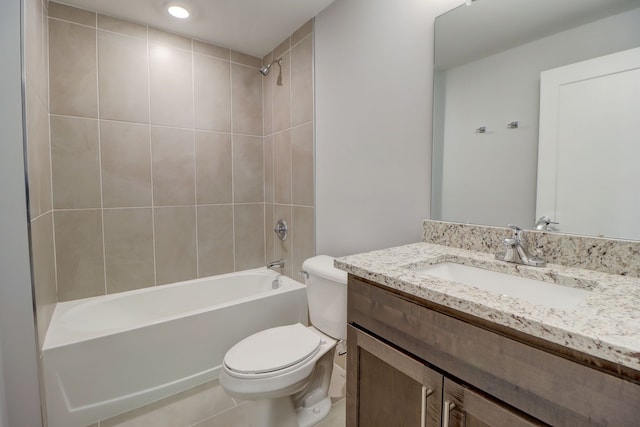 full bathroom with tile patterned flooring, vanity, toilet, and tiled shower / bath