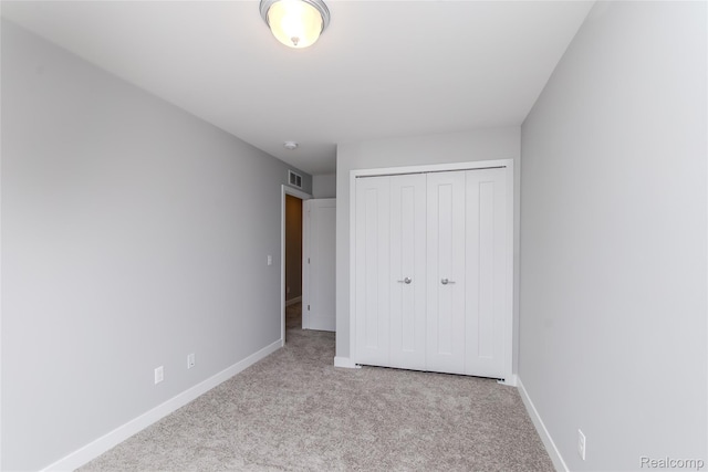 25495 Grandview Ln Unit 25, Novi, MI 48375 - unfurnished bedroom featuring carpet flooring and a closet