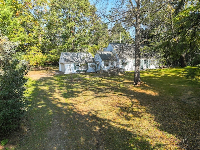 view of yard with a wooden deck