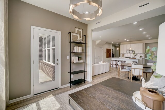 dining space featuring light hardwood / wood-style floors