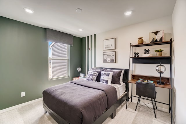 bedroom with recessed lighting, light colored carpet, and baseboards